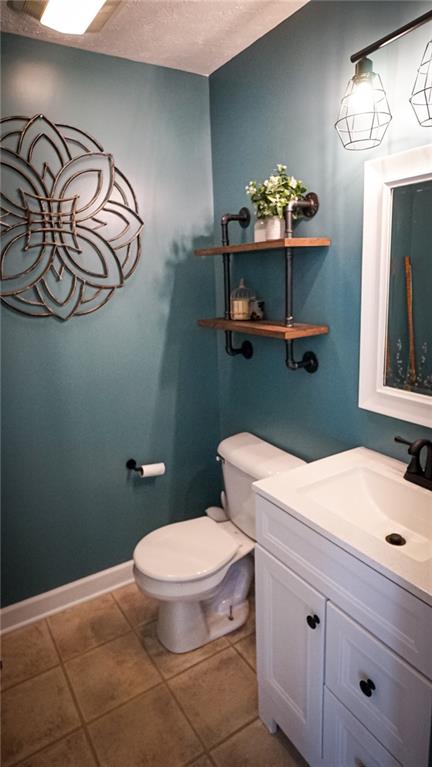 669 Unionville Road Butler, PA 16001 - Photo 19 of 21 a bathroom with a toilet a sink and mirror
