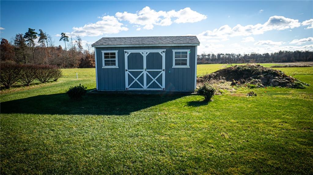 669 Unionville Road Butler, PA 16001 - Photo 21 of 21 a view of a house with backyard and garden