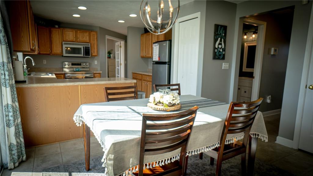 669 Unionville Road Butler, PA 16001 - Photo 5 of 21 a table and chairs in a kitchen