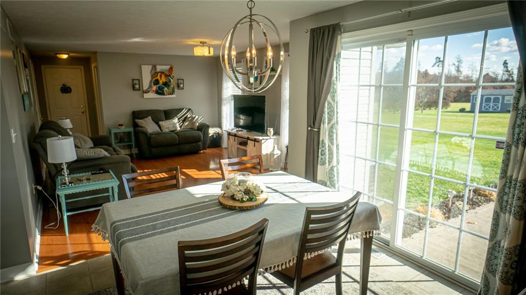 669 Unionville Road Butler, PA 16001 - Photo 7 of 21 a view of a dining room with furniture a chandelier and wooden floor