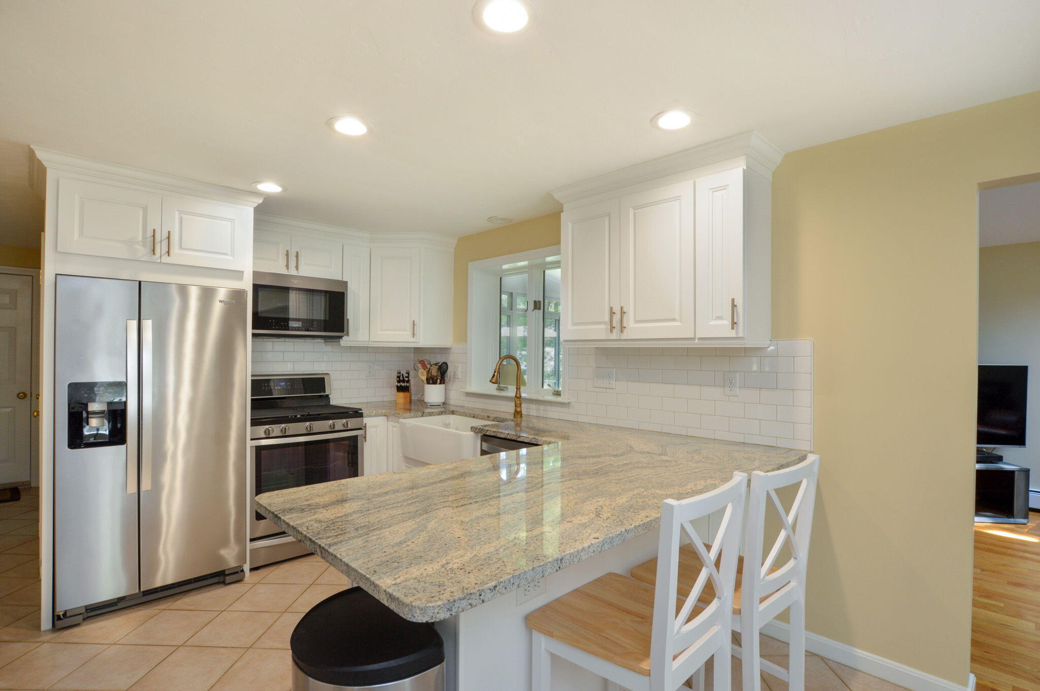 48 Hogan Drive Mashpee, MA 02649 - Photo 15 of 36 a kitchen with stainless steel appliances granite countertop a sink refrigerator and cabinets