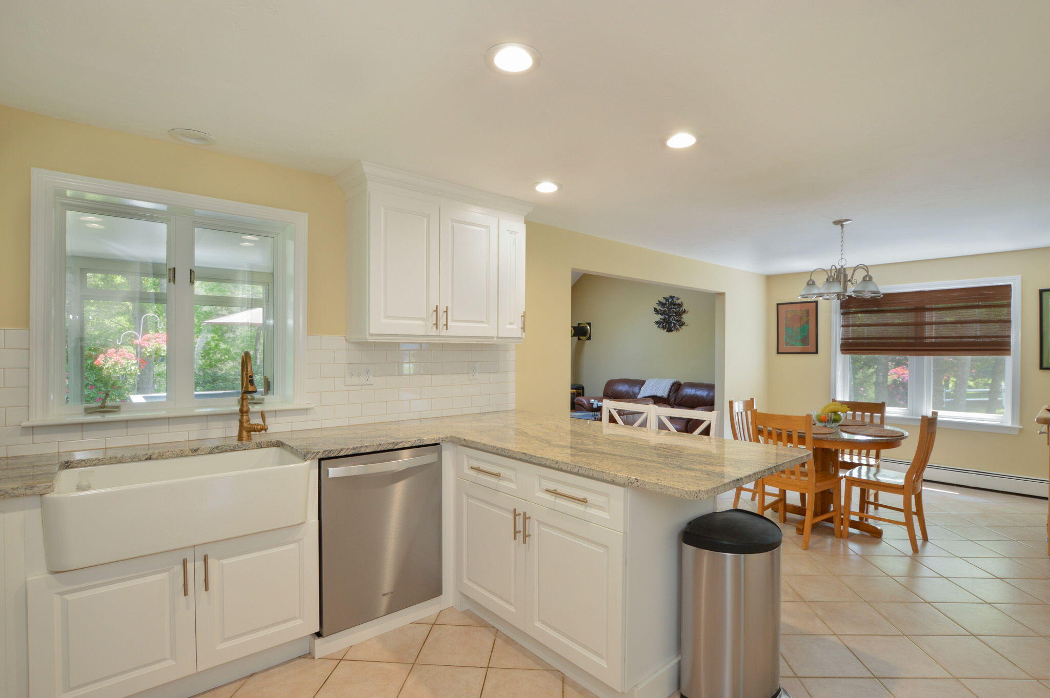 48 Hogan Drive Mashpee, MA 02649 - Photo 17 of 36 a kitchen with white cabinets and sink