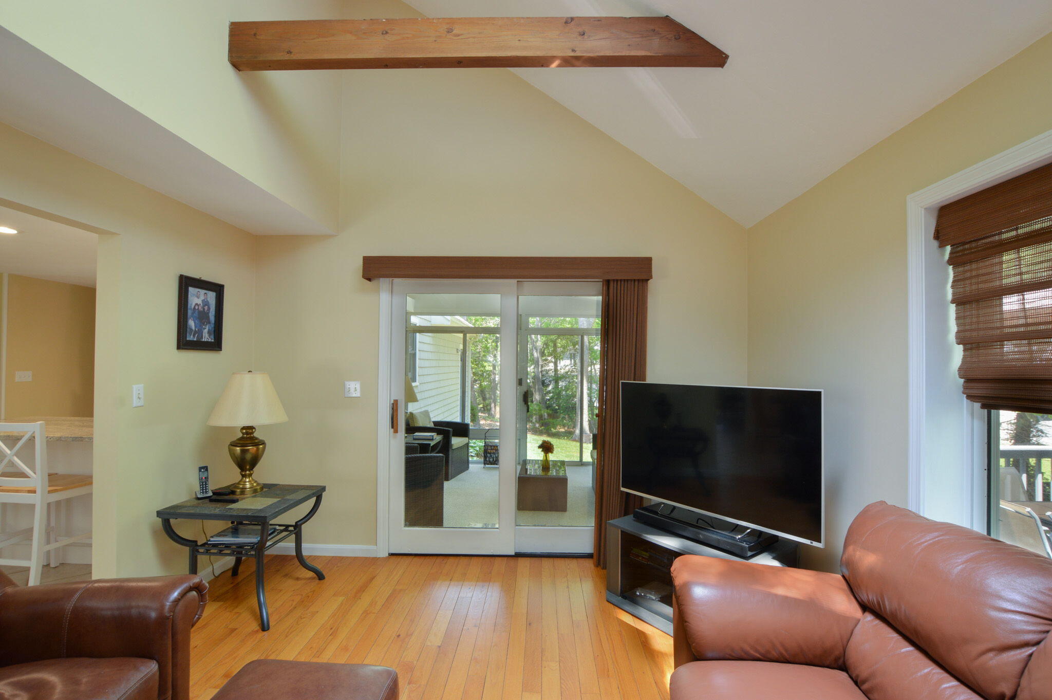48 Hogan Drive Mashpee, MA 02649 - Photo 20 of 36 a living room with furniture and a flat screen tv