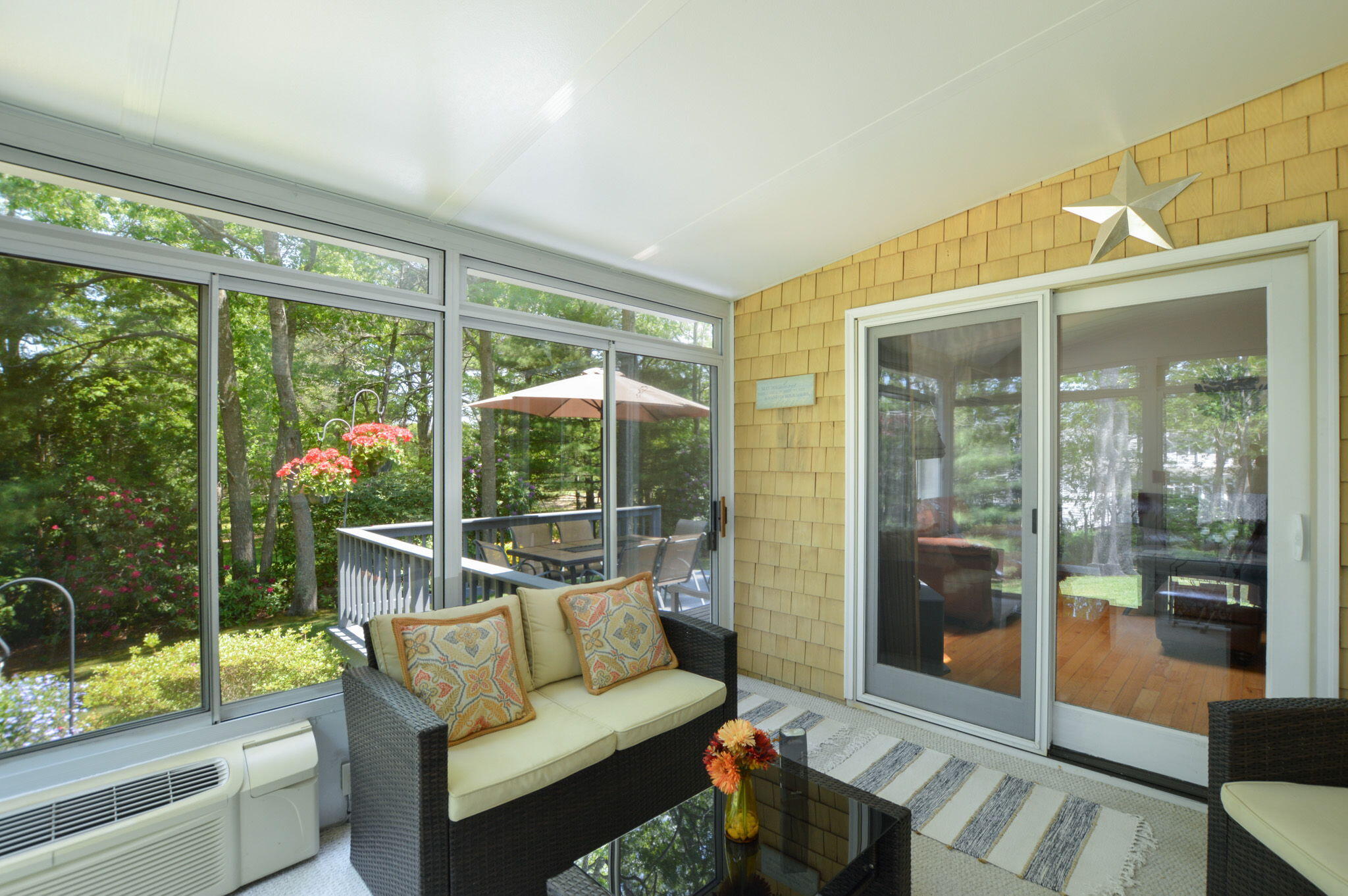 48 Hogan Drive Mashpee, MA 02649 - Photo 22 of 36 a balcony with furniture and a garden