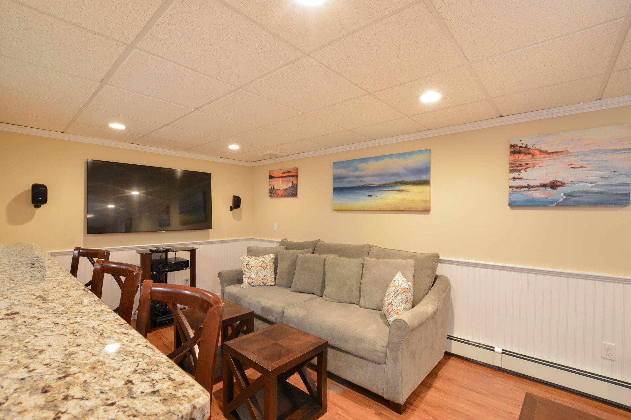 48 Hogan Drive Mashpee, MA 02649 - Photo 31 of 36 a living room with furniture and a flat screen tv