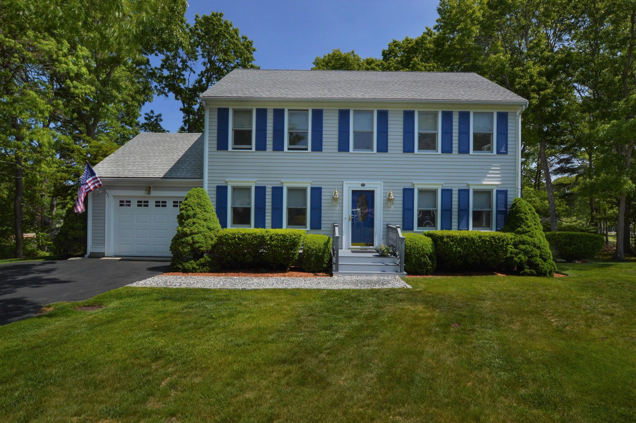 48 Hogan Drive Mashpee, MA 02649 - Photo 36 of 36 a front view of a house with a yard