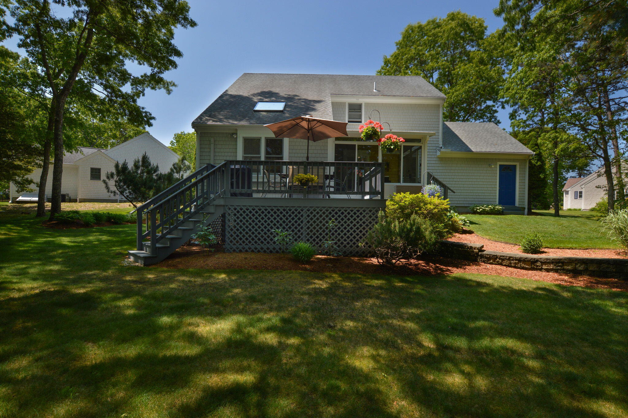 48 Hogan Drive Mashpee, MA 02649 - Photo 5 of 36 a front view of house with yard and green space