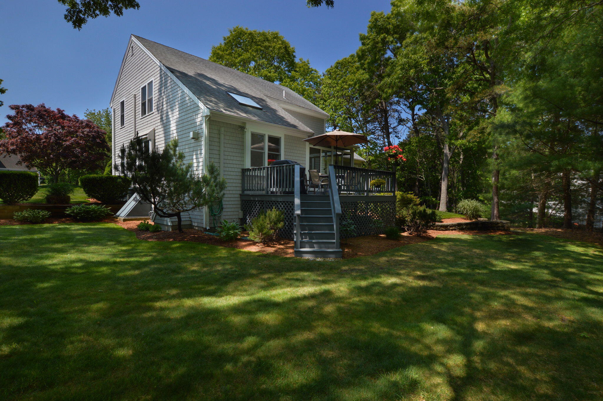 48 Hogan Drive Mashpee, MA 02649 - Photo 6 of 36 a view of a house with backyard and sitting area