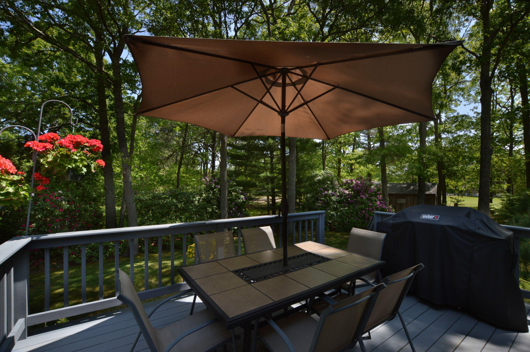 48 Hogan Drive Mashpee, MA 02649 - Photo 7 of 36 a view of balcony with furniture and umbrella