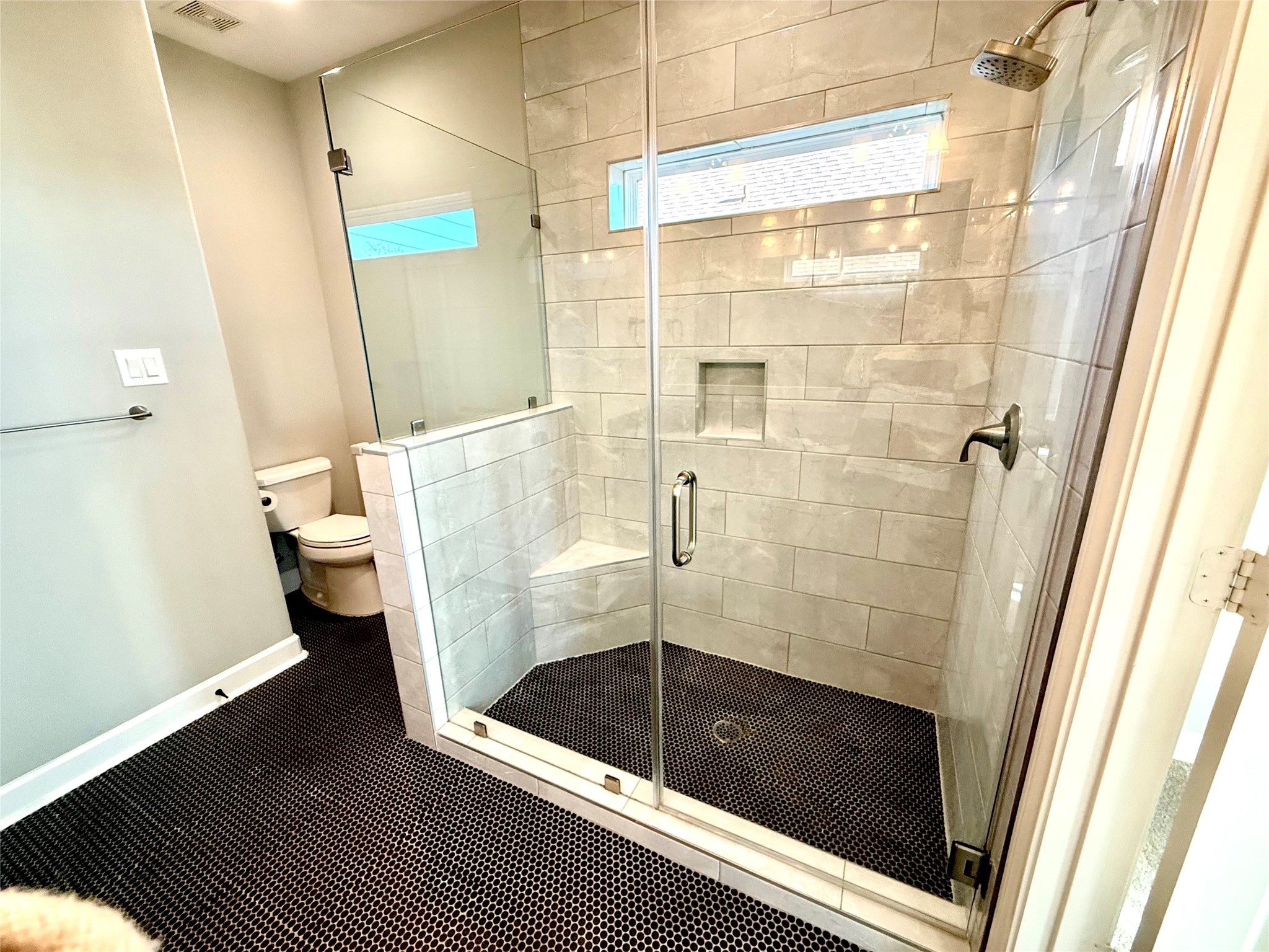 9206 Anna Street Needville, TX 77461 - Photo 11 of 24 a bathroom with a shower and a toilet