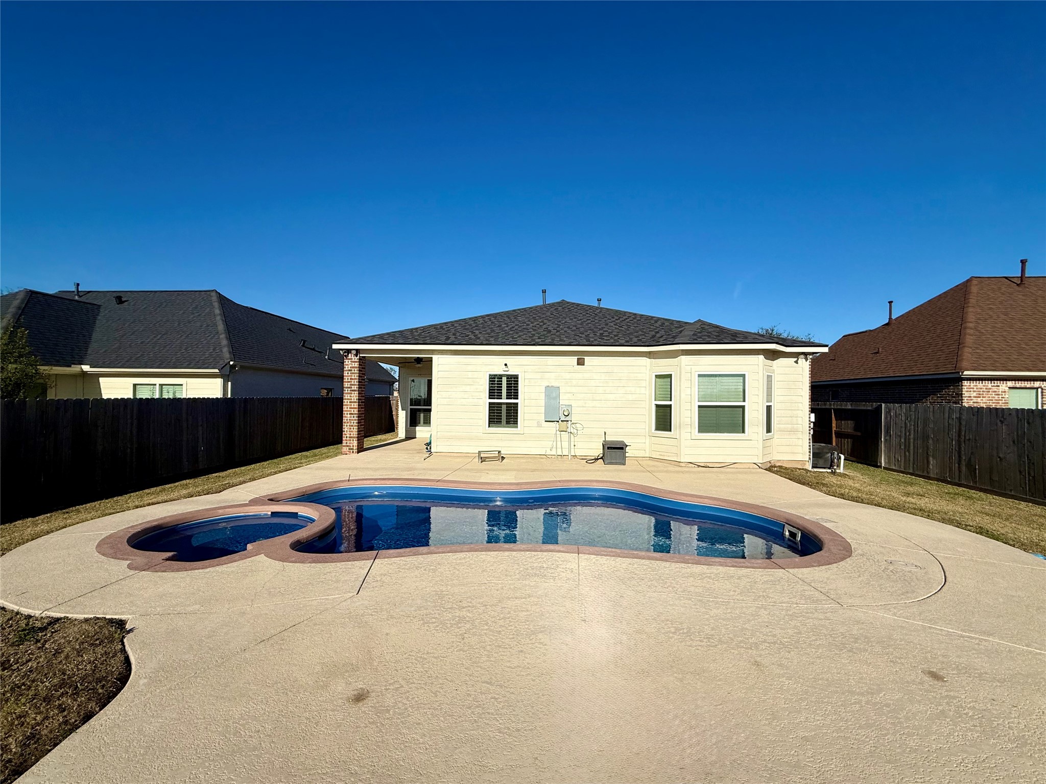 9206 Anna Street Needville, TX 77461 - Photo 21 of 24 a front view of house with swimming pool and porch