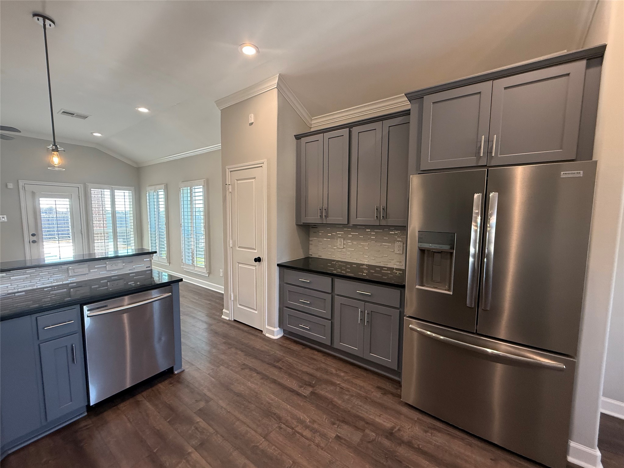 9206 Anna Street Needville, TX 77461 - Photo 5 of 24 a kitchen with stainless steel appliances granite countertop a refrigerator a sink and a stove