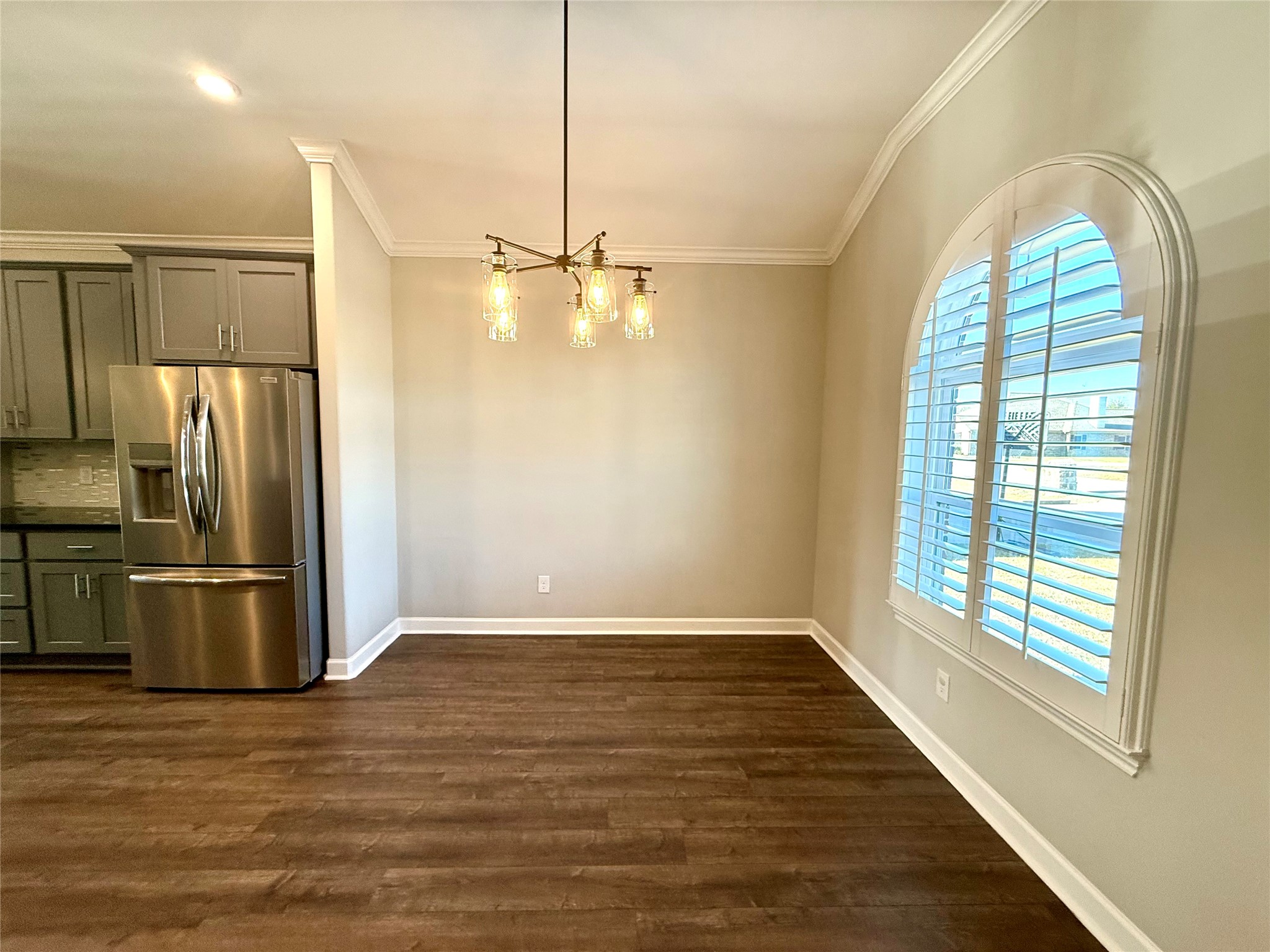 9206 Anna Street Needville, TX 77461 - Photo 6 of 24 a view of a kitchen with a sink and refrigerator