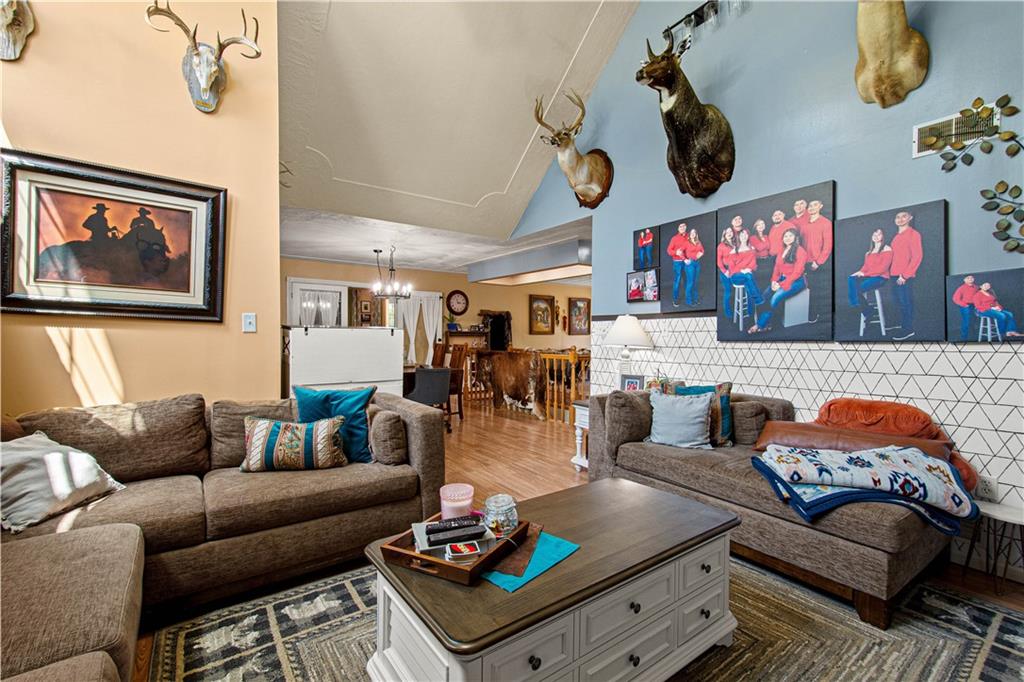 3054 Bedillion Road Washington, PA 15301 - Photo 3 of 47 Spacious open-concept living area with a cozy fireplace and seamless flow into the main living spaces.