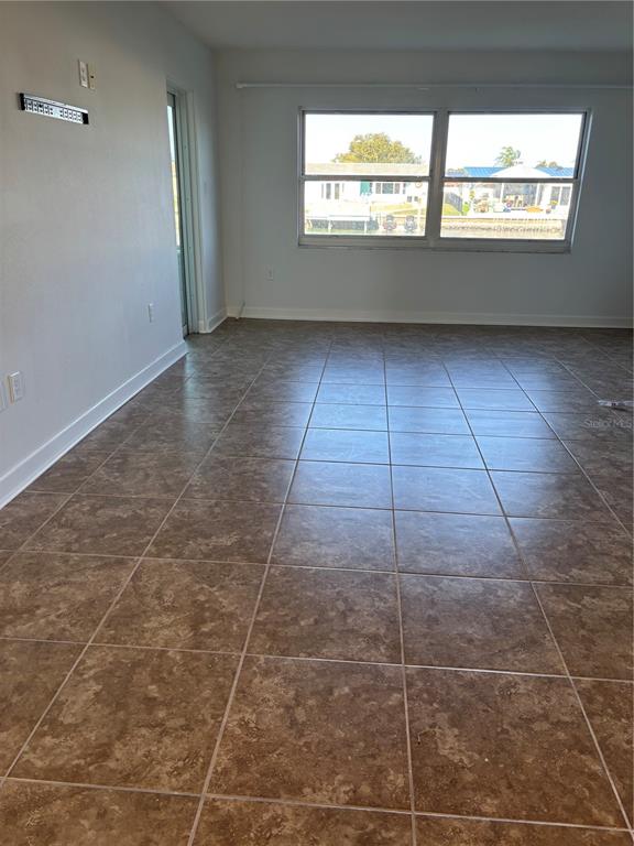 4725 Cove Circle, Unit 104 Madeira Beach, FL 33708 - Photo 14 of 22 a view of an empty room and window