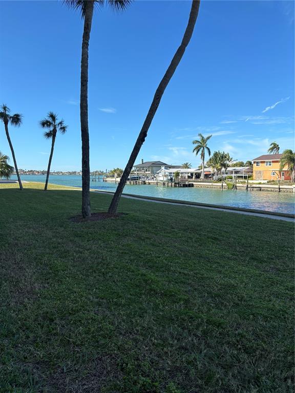 4725 Cove Circle, Unit 104 Madeira Beach, FL 33708 - Photo 16 of 22 a view of a field with an ocean