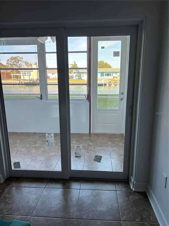 4725 Cove Circle, Unit 104 Madeira Beach, FL 33708 - Photo 9 of 22 a view of an empty room and window