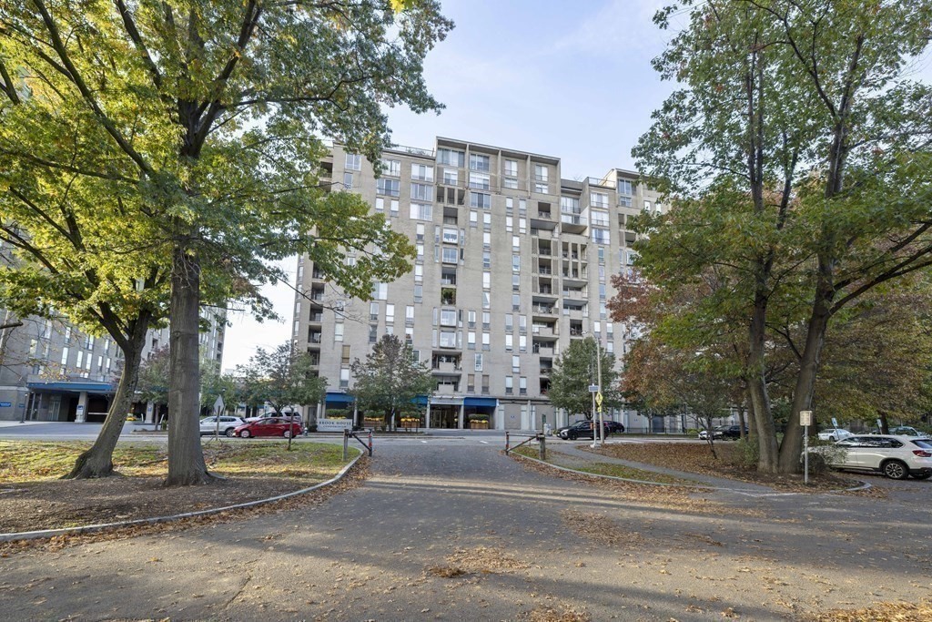 33 Pond Avenue, Unit 912 Brookline, MA 02445 - Photo 15 of 17 a building with trees in front of it