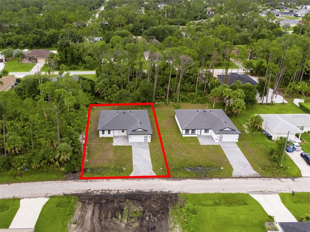 4450 Badali Road North Port, FL 34286 - Photo 22 of 28 an aerial view of residential houses with yard and swimming pool