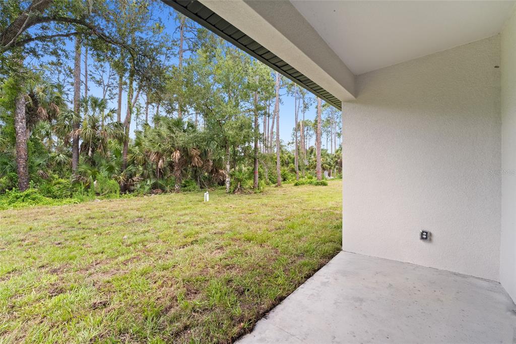 4450 Badali Road North Port, FL 34286 - Photo 24 of 28 a view of a yard with an outdoor space
