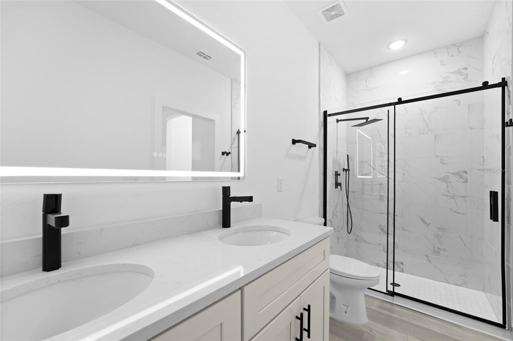 4450 Badali Road North Port, FL 34286 - Photo 8 of 28 a bathroom with a shower sink and toilet