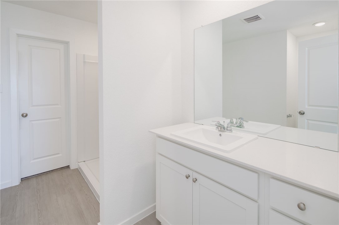 2441 Rooke Road Bryan, TX 77807 - Photo 14 of 23 a bathroom with a sink and a mirror
