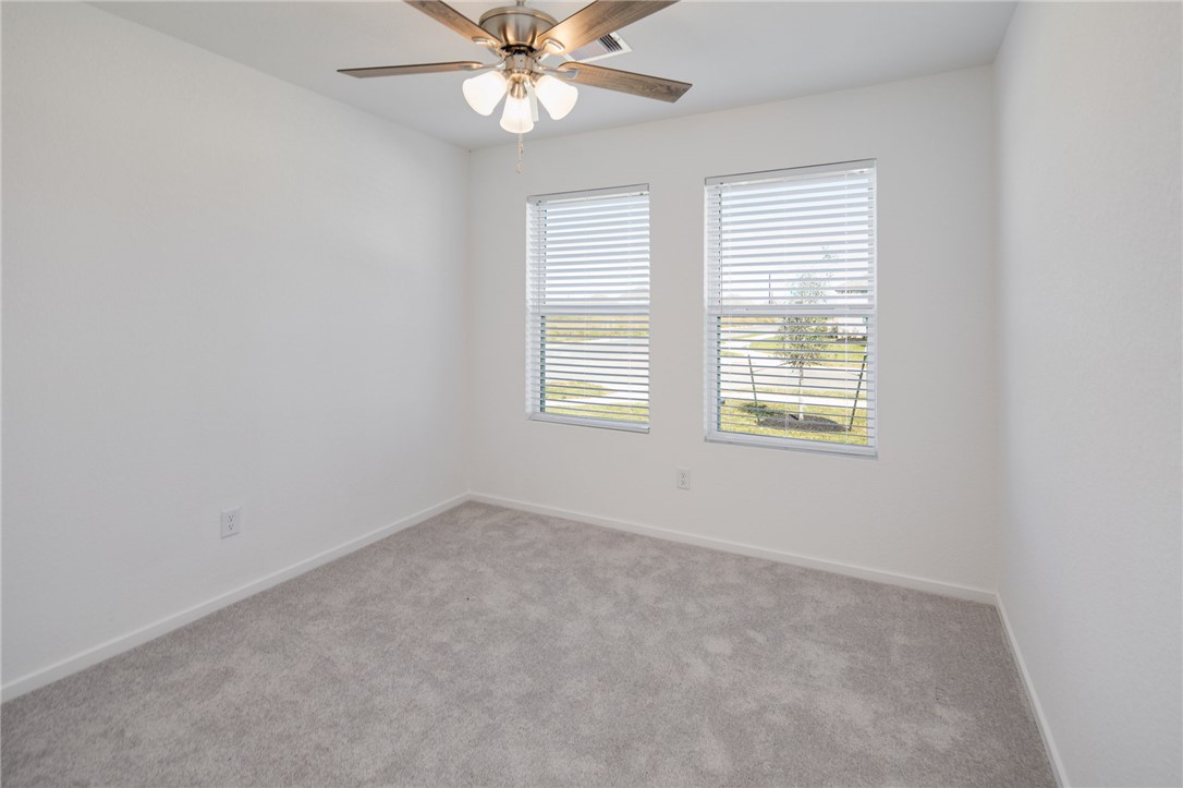 2441 Rooke Road Bryan, TX 77807 - Photo 17 of 23 an empty room with a window and a fan