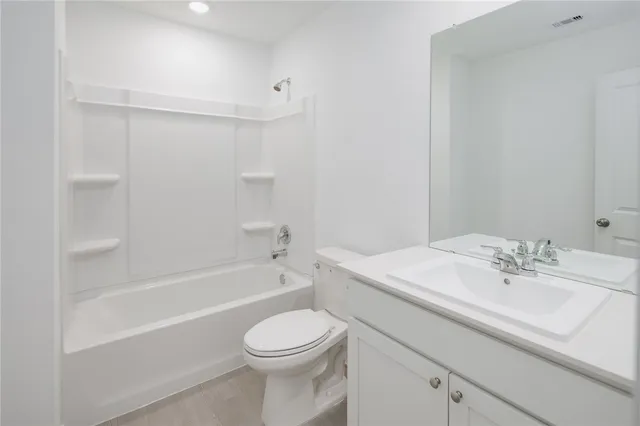 a bathroom with a sink a toilet and a bathtub