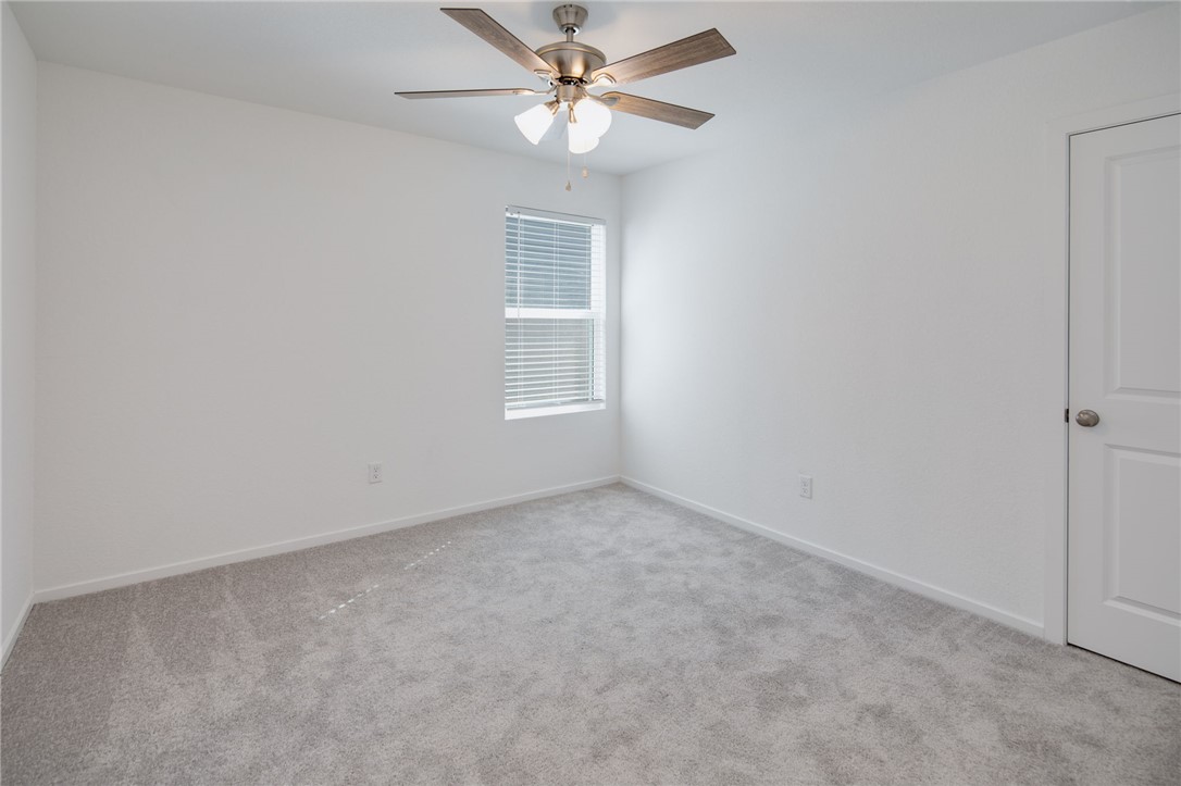 2441 Rooke Road Bryan, TX 77807 - Photo 20 of 23 an empty room with a window and a fan