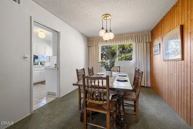 a kitchen with a sink cabinets and window