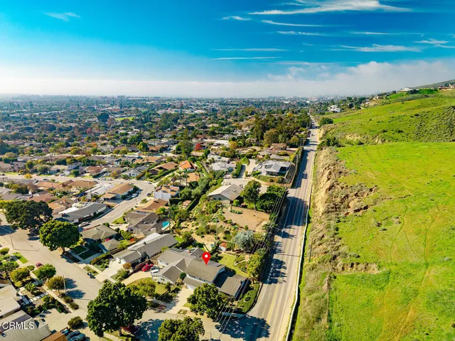 a view of an aerial view of beach and residential houses
