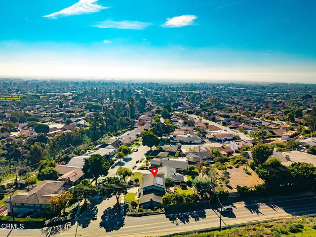 a swimming pool with outdoor seating and yard