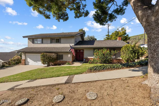 a bedroom with a large bed and a large window