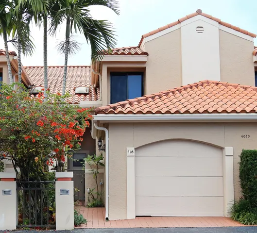 a front view of a house with a garage