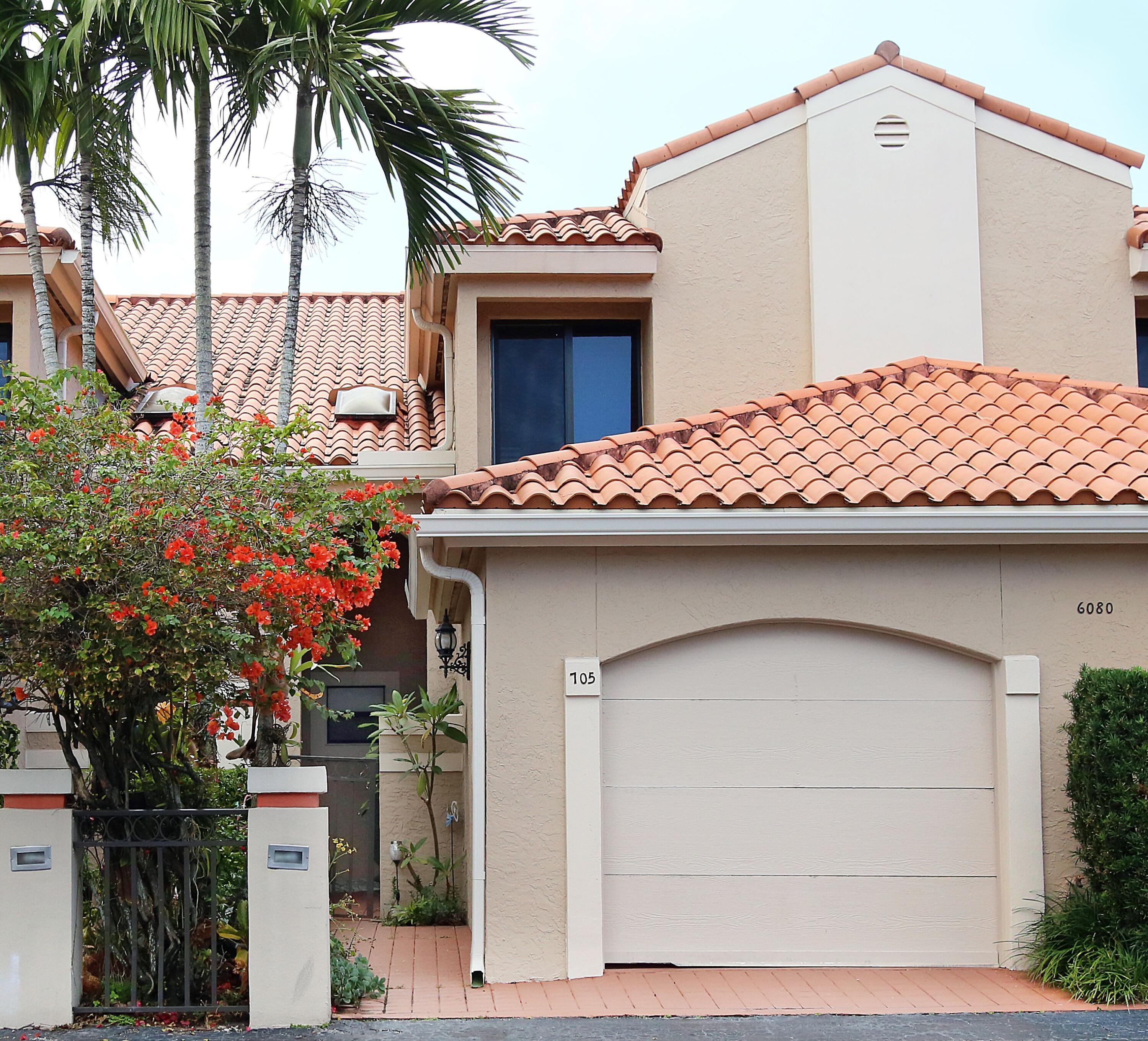 a front view of a house with a garage