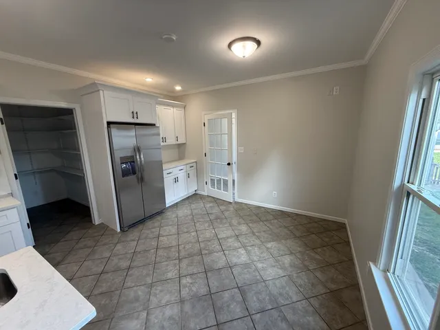 a kitchen with stainless steel appliances a refrigerator and a sink