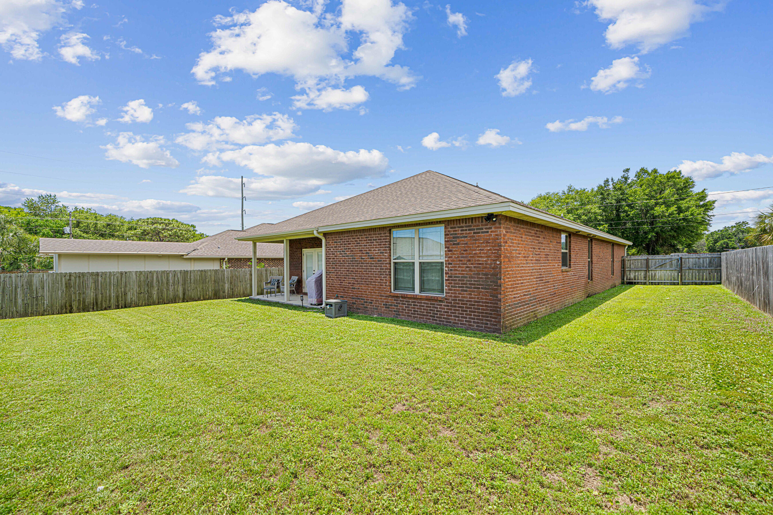 801 Playground Road Fort Walton Beach, FL 32547 - Photo 35 of 38 a house view with swimming pool and garden