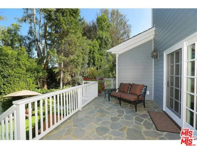 a view of a bench in the backyard