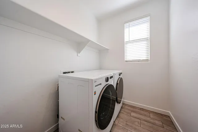 a utility room with dryer and washer