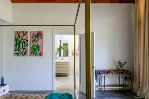 a bathroom with a sink a mirror and a shower