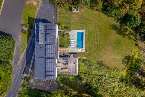 a view of a swimming pool with a yard
