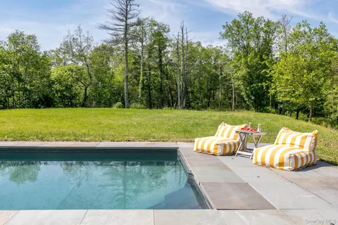 a view of swimming pool with a yard
