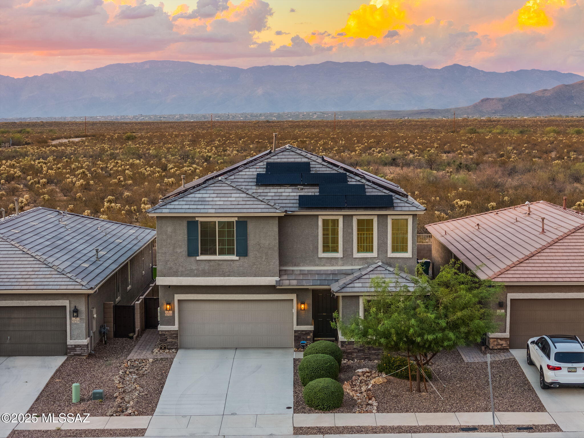12100 East Ryscott Circle Vail, AZ 85641 - Photo 3 of 53 a front view of a house with a yard