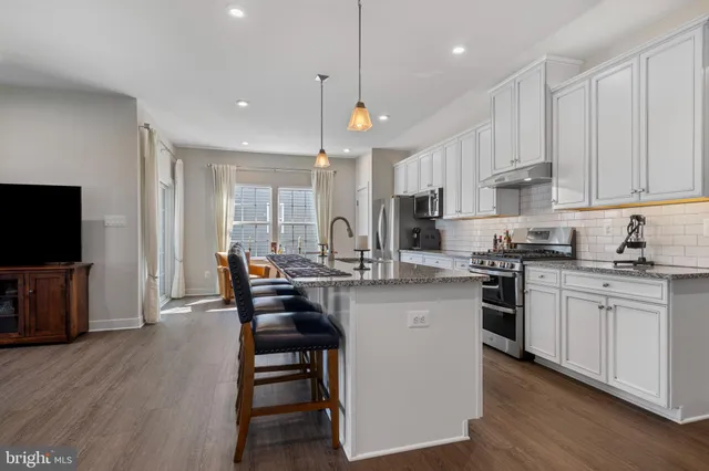 a view of living room with furniture and fireplace