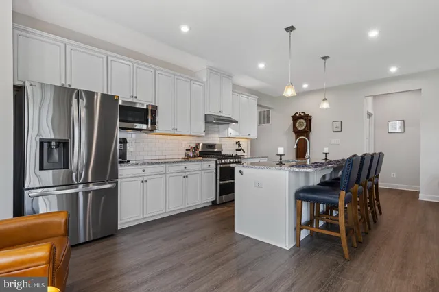 a open kitchen with a sink a fireplace and a fireplace