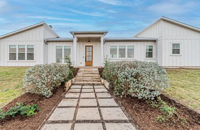 front view of a house with a yard