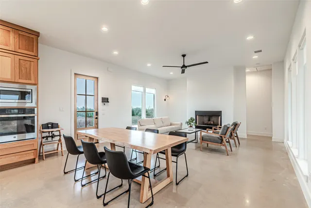 a bedroom with a bed and large window