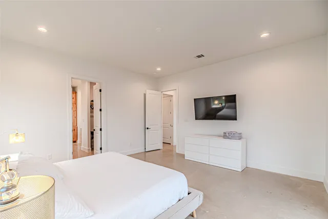 a room with a dresser and mirror