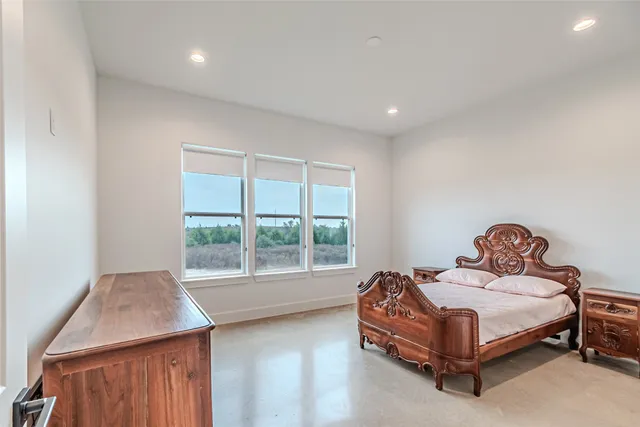 a bathroom with a bathtub and next to a window