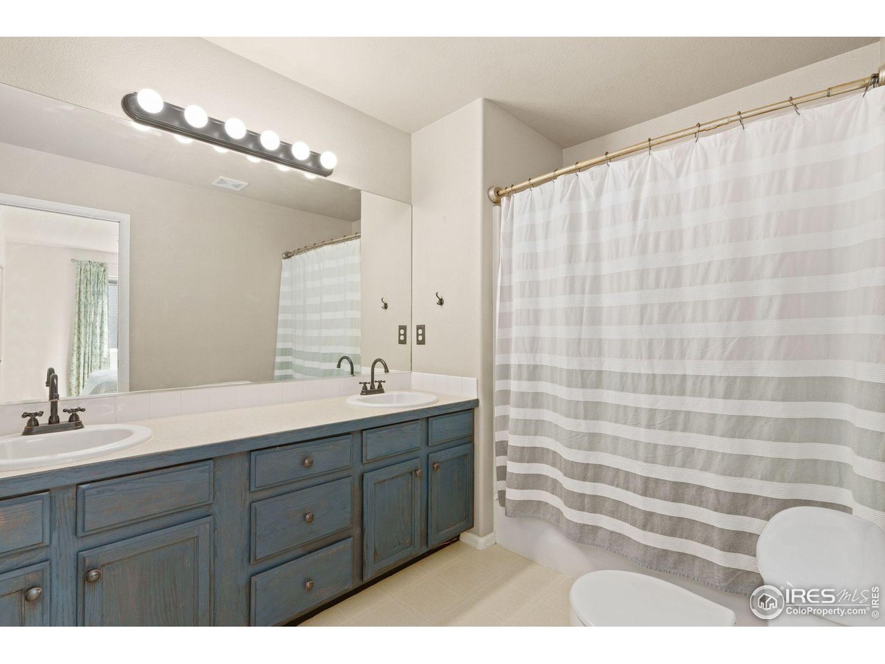 4418 West 30th Street Road Greeley, CO 80634 - Photo 14 of 24 Main level bath, dual sinks